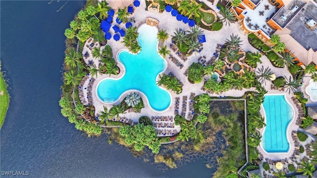 birds eye view of property with a water view