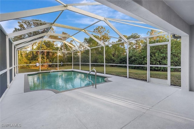 outdoor pool featuring a patio, a yard, and a lanai