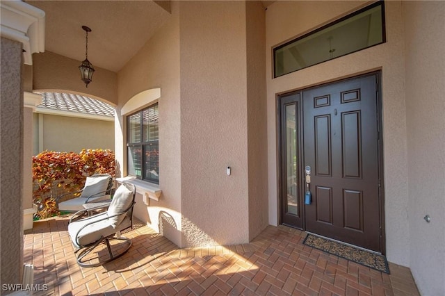 doorway to property with stucco siding