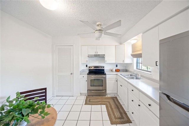 kitchen featuring light countertops, appliances with stainless steel finishes, white cabinets, a sink, and under cabinet range hood