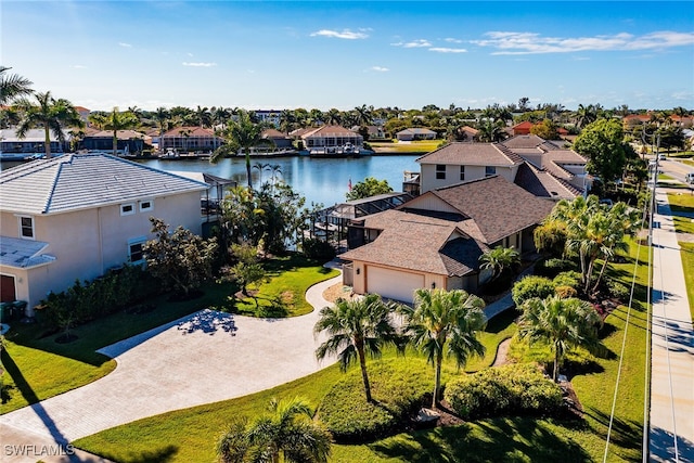 birds eye view of property featuring a residential view and a water view