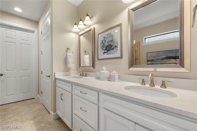 full bath with tile patterned floors, a sink, and double vanity