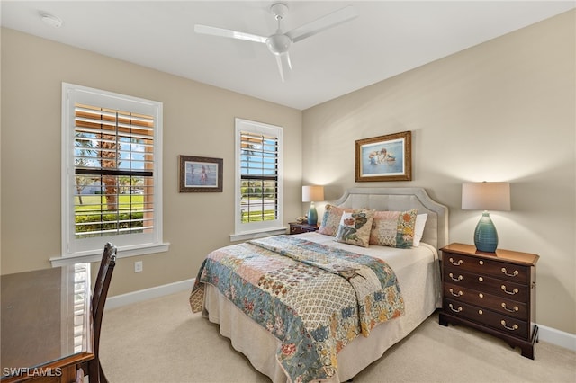 bedroom featuring carpet floors, baseboards, and a ceiling fan