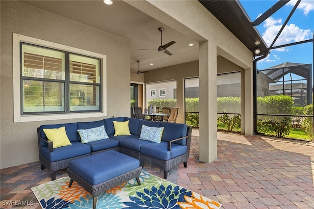 view of patio / terrace with an outdoor hangout area, a lanai, and a ceiling fan