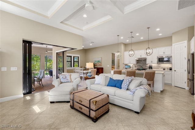 living room with visible vents, coffered ceiling, a ceiling fan, and beamed ceiling