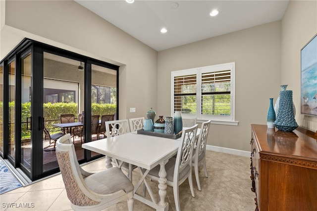 dining room with light tile patterned floors, recessed lighting, and baseboards