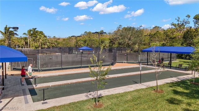 surrounding community featuring a lawn and fence