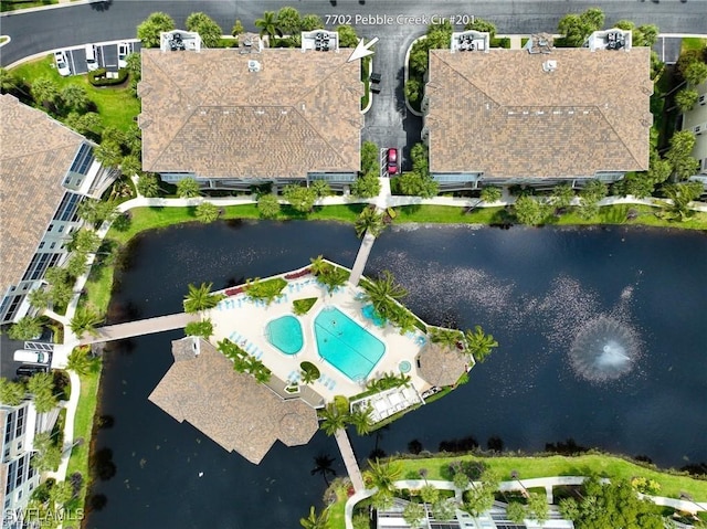 birds eye view of property featuring a water view