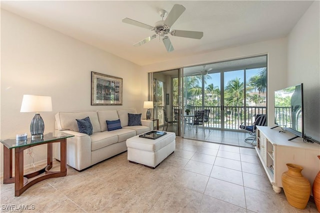 living area featuring a ceiling fan and light tile patterned flooring