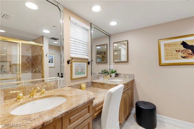 445 3rd Ave S Unit 102, Naples, FL 34102 - bathroom featuring vanity, a stall shower, tile patterned floors, and recessed lighting