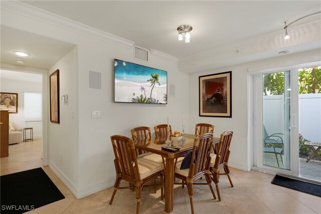 445 3rd Ave S Unit 102, Naples, FL 34102 - dining room featuring light tile patterned floors and ornamental molding
