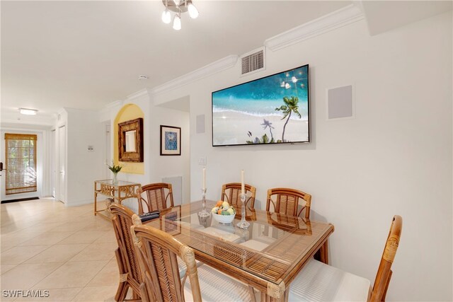 445 3rd Ave S Unit 102, Naples, FL 34102 - dining room featuring ornamental molding and light tile patterned floors