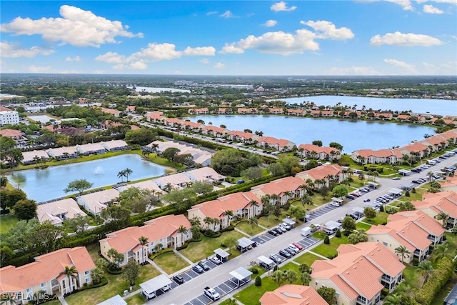 birds eye view of property with a residential view and a water view