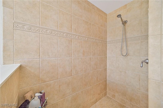 full bath featuring a tile shower