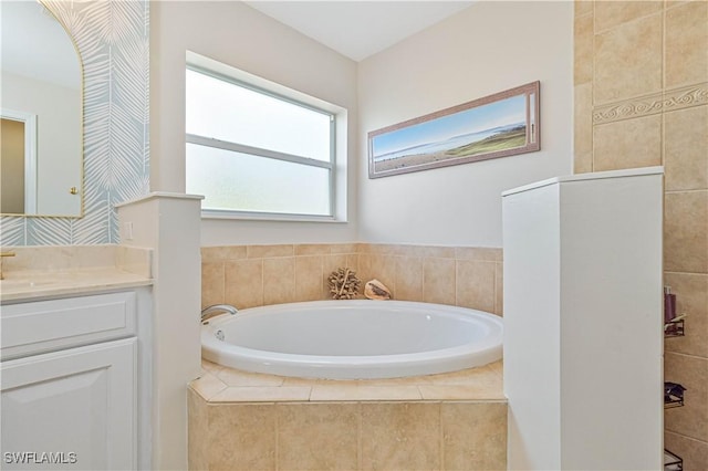 bathroom with a bath and vanity