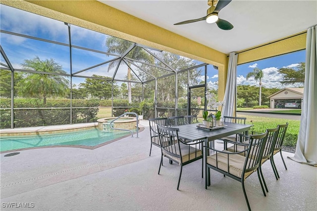 view of pool featuring a patio, glass enclosure, ceiling fan, a pool with connected hot tub, and outdoor dining space