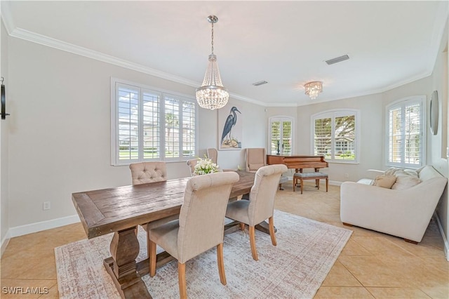 dining area with light tile patterned floors, ornamental molding, visible vents, and baseboards