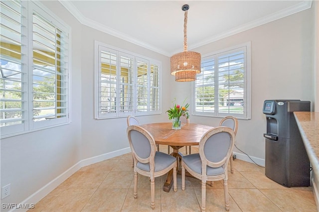dining area featuring ornamental molding, baseboards, and light tile patterned floors