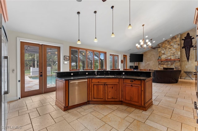 kitchen with an island with sink, open floor plan, hanging light fixtures, french doors, and stainless steel dishwasher