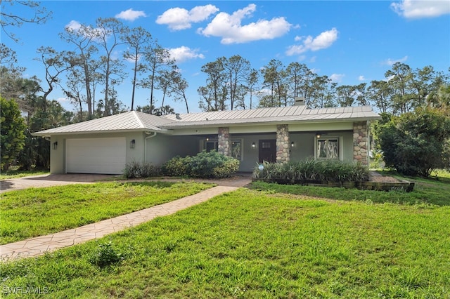 single story home featuring metal roof, an attached garage, a front lawn, and stucco siding