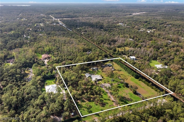 drone / aerial view with a view of trees