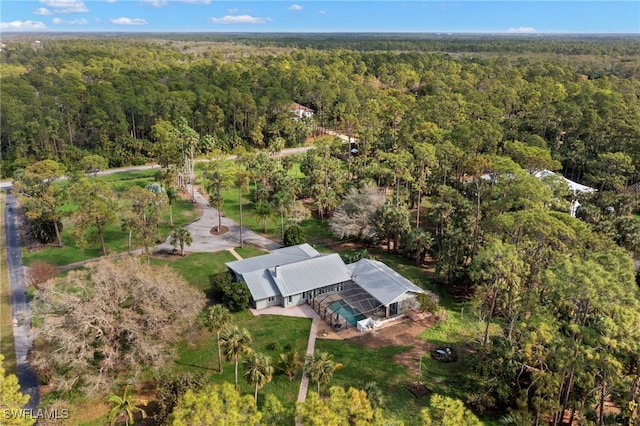 drone / aerial view featuring a view of trees