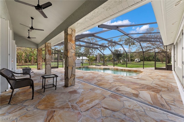 view of patio featuring glass enclosure and an outdoor pool