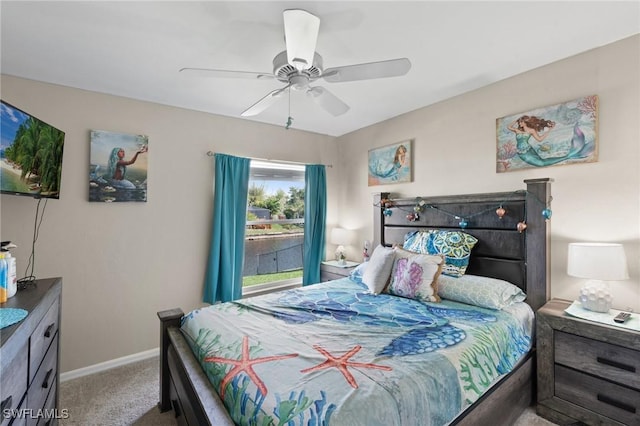 carpeted bedroom featuring ceiling fan and baseboards