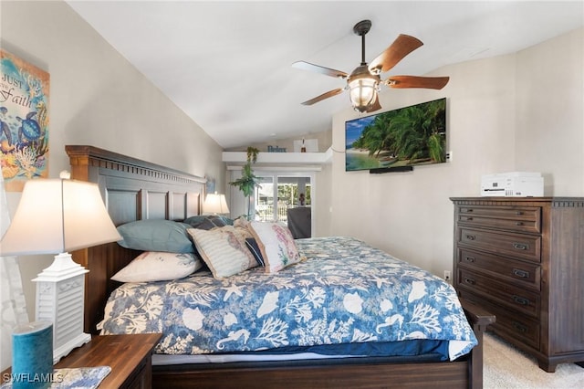 bedroom with lofted ceiling, ceiling fan, and light carpet