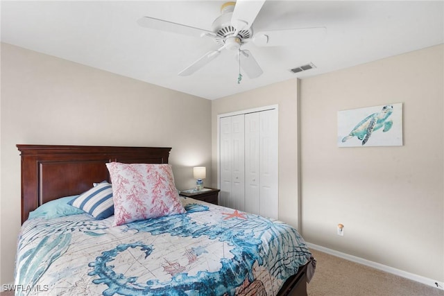 carpeted bedroom with a ceiling fan, baseboards, visible vents, and a closet