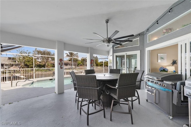 exterior space with a fenced in pool, a ceiling fan, area for grilling, fence, and outdoor dining area