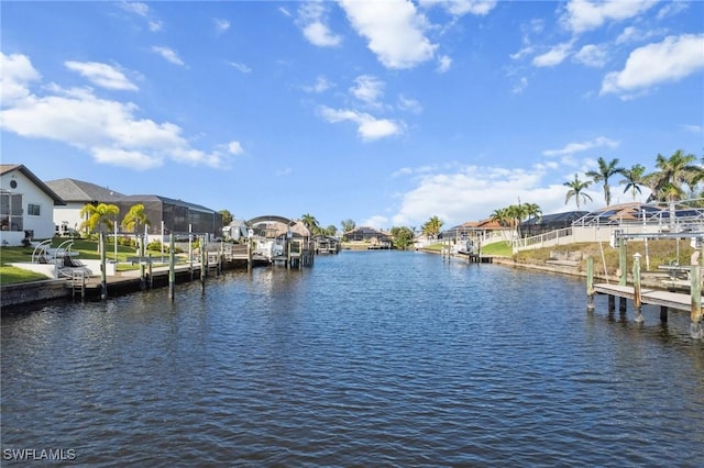 view of dock with a residential view and a water view