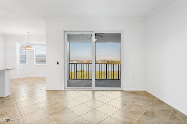 empty room with baseboards, ornamental molding, and light tile patterned flooring