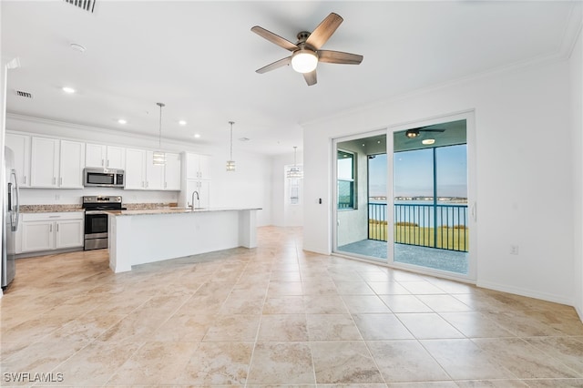 kitchen with visible vents, ceiling fan, ornamental molding, stainless steel appliances, and a sink