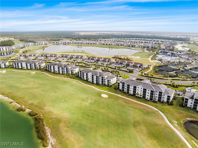 bird's eye view with a water view and golf course view