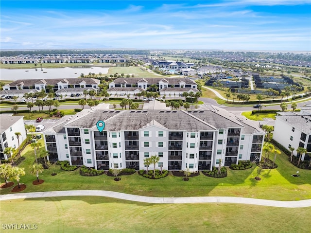 birds eye view of property with a residential view