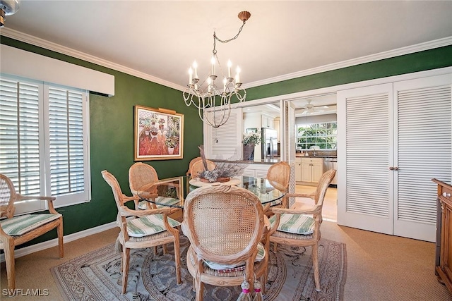 dining area featuring light carpet, an inviting chandelier, baseboards, and ornamental molding