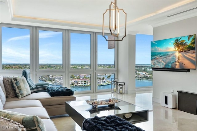 living area featuring ornamental molding, a raised ceiling, visible vents, and floor to ceiling windows