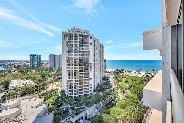 view of property with a water view and a city view