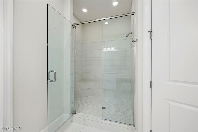 bathroom featuring a shower stall and recessed lighting