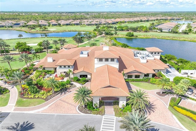 drone / aerial view featuring a residential view and a water view