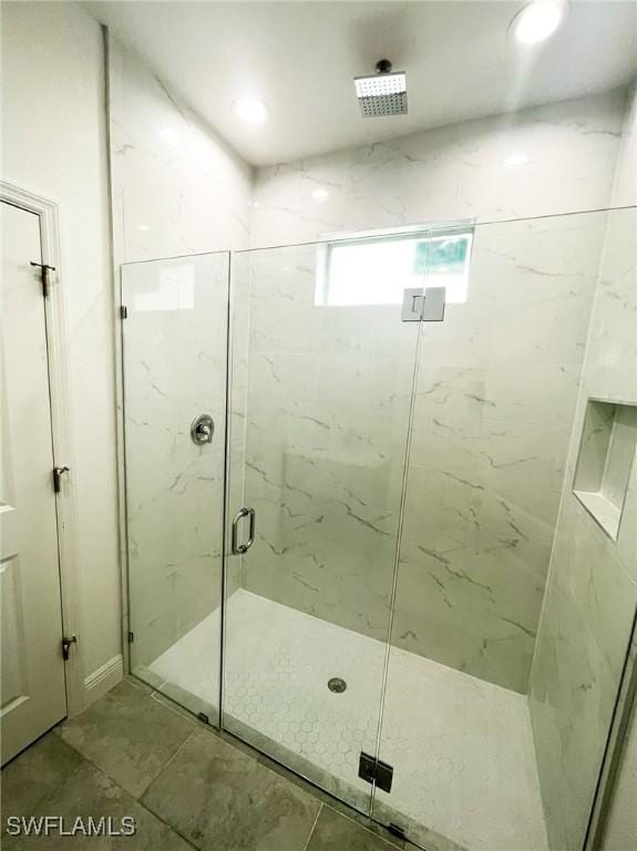 full bath featuring a marble finish shower and recessed lighting