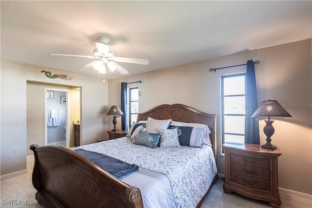 bedroom featuring baseboards and a ceiling fan