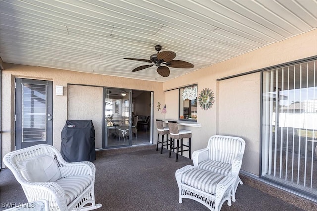 view of patio / terrace featuring a grill and ceiling fan