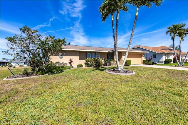 single story home with driveway, a garage, a front yard, and stucco siding