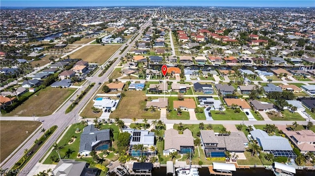 birds eye view of property with a residential view