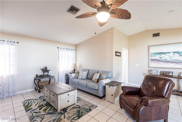 living area with vaulted ceiling, light tile patterned floors, visible vents, and a ceiling fan