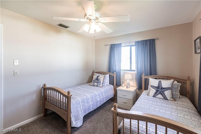 carpeted bedroom with baseboards, visible vents, and a ceiling fan