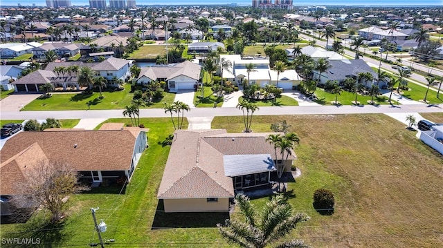 birds eye view of property with a residential view