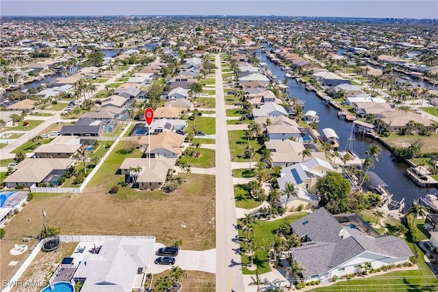 bird's eye view with a water view and a residential view